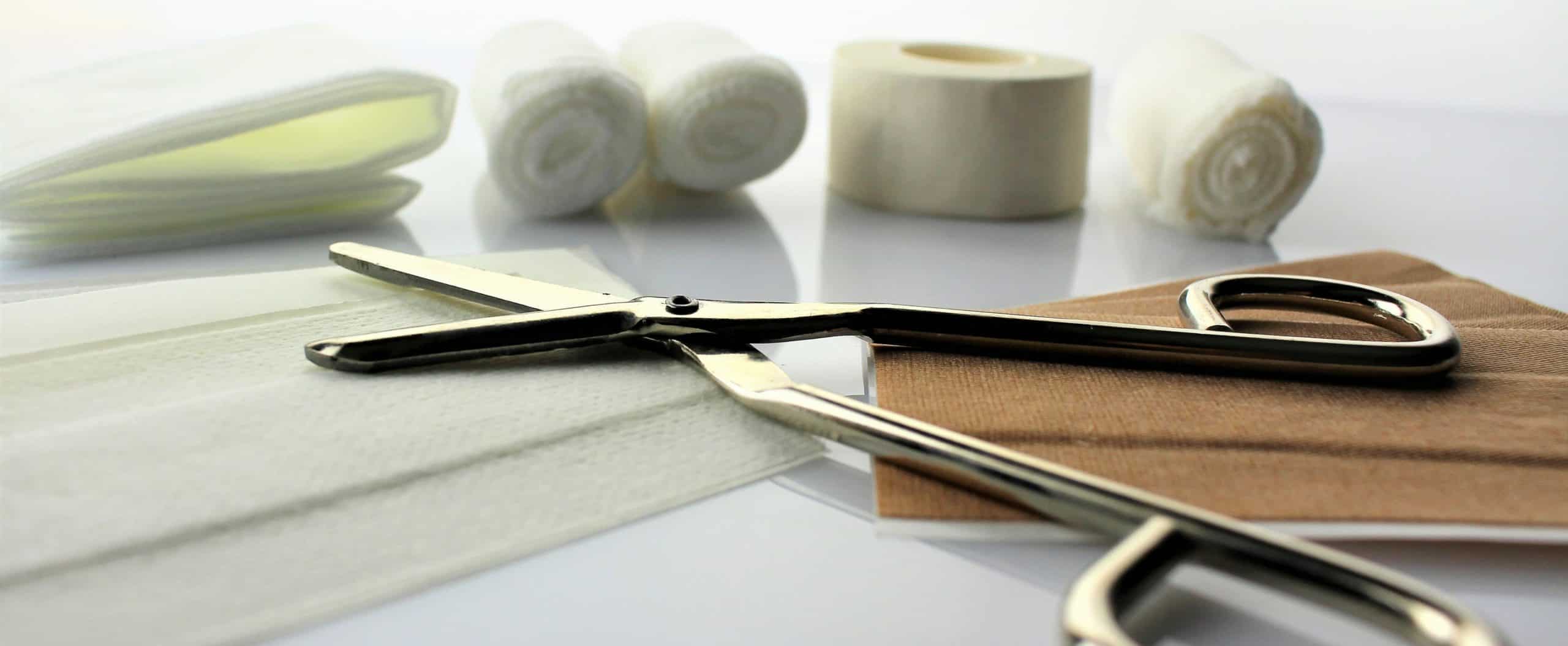scissors, bandages, cotton balls, and medical tape for addiction wound care