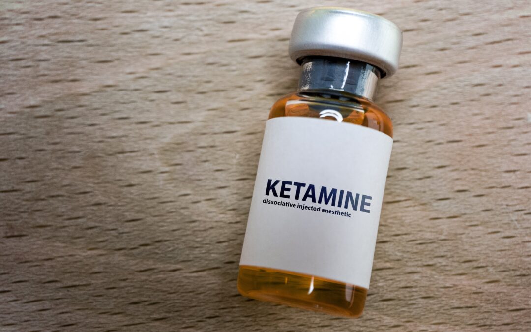 bottle of ketamine on table